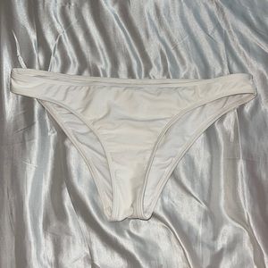 White bikini bottoms never worn. Mostly full coverage a little cheeky